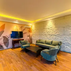 The interior of one of my custom rooftop rooms. This space is designed as a comfortable lounge with a feature wall, elegant seating, and full climate control, making it usable year-round.