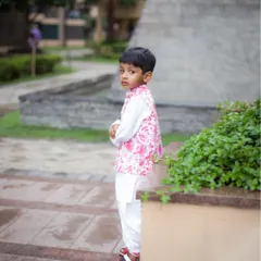 A candid shot of a young boy during his outdoor birthday photoshoot. We capture those in-between moments that reveal a child's true personality.