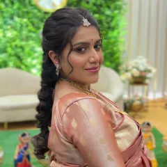 A beautiful smiling portrait of the mother-to-be, looking radiant with her special occasion hairstyle.