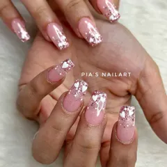Glitter ombre nails with cute little white hearts. A sweet and sparkly design.