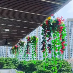 Simple and colorful hanging baskets for a balcony. I used artificial vines and flowers that cascade down, adding color and life without taking up any floor space.