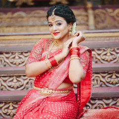 A full photoshoot series of a model in a stunning red bandhani-style saree with a detailed embroidered blouse, set against a royal backdrop.