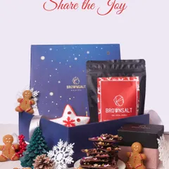 Our gifting solutions go beyond a single season. Here is our "Share the Joy" Christmas hamper, filled with festive treats like gingerbread cookies, chocolate barks, and our special Xmas Granola. It shows our capability to create unique, themed hampers for any corporate celebration throughout the year.