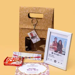 A modern Rakhi gift set for a brother. This hamper includes a personalized Spotify frame, a custom keychain, a 'World's Best Bro' card, a Rakhi, and some chocolates.