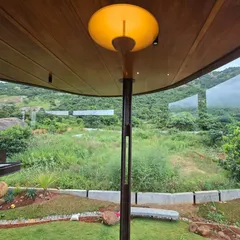 The foyer at Villa Soham acts as a threshold to the natural world. It is a quiet, contemplative space designed specifically to draw the eye towards the foothills, setting a tone of tranquility from the moment you enter.