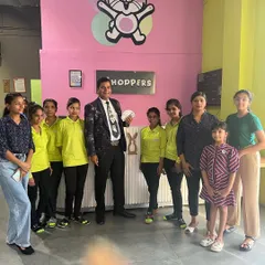 The magician posing with our dedicated staff after a fantastic show. We work with talented professionals to elevate your event.