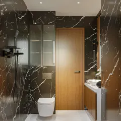 Another view of the bold black marble bathroom. This shot highlights the spacious layout, the wooden door that adds warmth, and the sleek, modern fixtures that complete the high-end look.
