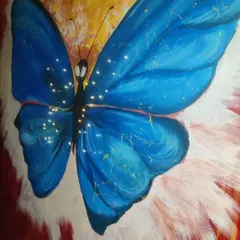 We can even incorporate lighting into our wall art. For this blue butterfly painting, we embedded tiny fairy lights into the canvas, making the artwork glow and creating a magical effect in the evening.