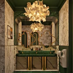 For the men's washroom at Koko, we went with a rich, moody palette of emerald green marble and tiles, paired with a statement floral chandelier and custom wallpaper.