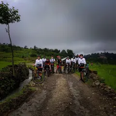A group of young riders ready to take on a muddy trail. We are passionate about building the next generation of mountain bikers in India.
