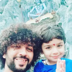 Sharing a blessed moment with my son in front of a beautiful Shiva murti. Passing on our traditions and faith to the next generation is so important to me, and I bring this sense of family and devotion to every event.