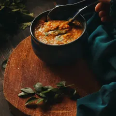 Food is full of emotion and tradition. For this shot of Daleem, a dish close to my heart, I used a moody, dark style with rich textures to create a feeling of warmth and comfort. Adding my own hand shows the human connection I believe every meal has.