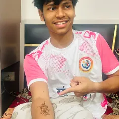 A happy client showing off his simple 'Om' symbol henna tattoo on his arm. A great choice for men and boys at festivals.