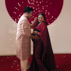 A tender moment between the couple, as he gently adjusts her hair. These small gestures of care and connection are what make a couple's maternity photoshoot so special.