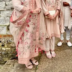 A beautiful shot of our clients, a mother and daughter duo, redefining elegance in their color-customized embroidered suits. Each piece is crafted to celebrate individuality and timeless grace.