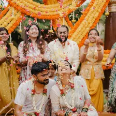 The pure joy of a Haldi ceremony is unmatched. We love creating vibrant, fun-filled settings where couples and their families can make memories, like this moment where Ketaki and Rakesh were showered with love and flower petals.