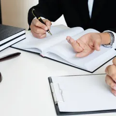 A handshake over a desk with a gavel nearby symbolizes the professional relationship we build with our clients. We are here to provide trusted legal counsel and representation, ensuring your matters are handled with expertise.