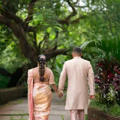A romantic walk in the park. This couple looks stunning in their coordinated pastel outfits, perfect for their pre-wedding photoshoot.