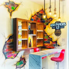 For this home mini-bar, I used a hand-painted broken brick effect to create a rustic and stylish look. The 3D illusion of colorful bricks showing through the plaster adds texture and character, making this small corner a standout feature of the home.