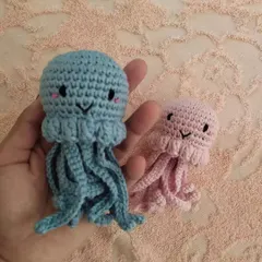 A sweet jellyfish duo in pink and blue. These can be customized in any size and color. The dangling tentacles are fun for little ones to play with.