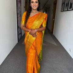 A full-length shot showcasing the elegance of the traditional saree paired with our signature natural makeup look.