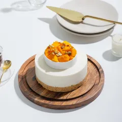 A slice of sunshine on a plate. Our Cold Mango Cheesecake features a creamy, rich layer over a buttery biscuit base, crowned with juicy mango chunks.