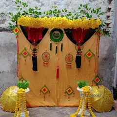 I create authentic and traditional Haldi setups right at your home. This decor uses a classic yellow marigold theme with gota patti hangings and decorative umbrellas for a truly desi function.