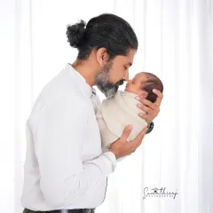 A father holding his newborn for the first time is a moment of quiet strength and tenderness. I aim to capture that powerful emotion in a simple, clean portrait that you will treasure forever.