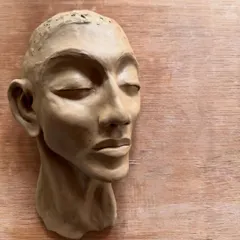 The evolution of a sculpture. This series shows a hand-built portrait bust from its raw clay form, to post-bisque firing, and finally with two different metallic glaze finishes.