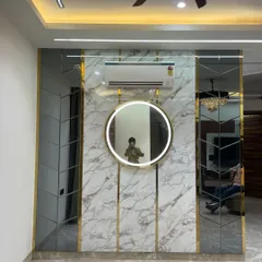 This selfie in the mirror shows the scale and reflective quality of the accent wall. It's a perfect example of how mirrors can make a room feel larger.