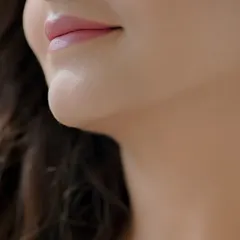 The perfect soft pink lip. This close-up shows the smooth application and beautiful color that complements a natural, dewy makeup look.