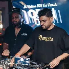 Side by side with DJ Nelson, both of us focused on delivering a seamless mix for the crowd.