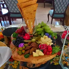Beyond the classics, I create stunning continental platters that wow your guests. This beautiful cheese board, with a mix of cheeses, fruits, and crackers, is a perfect example of how I can add a touch of modern elegance to your menu.