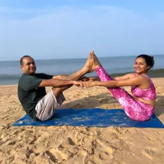 This is a partner version of Boat Pose, or Navasana, which we call Double Boat. It's a challenging and fun way to build core strength while relying on your partner for balance and support.