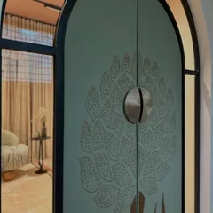 The finished fabric-wrapped entrance door, a testament to our material-driven design approach. The custom 3D floral motif, crafted from embellished fabric, makes a powerful first impression and sets the tone for the tactile experience within.
