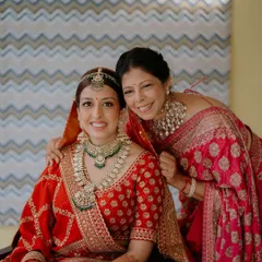 A beautiful portrait of a bride and her mother. For the mother, I focused on a classic look with a bright lip that complements her red and pink sari, ensuring she looked and felt her absolute best.