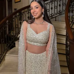 The sister of the bride serving main character energy. We went for a full glam look with shimmer, soft pink tones, and a sharp winged eyeliner to match her sparkling Manish Malhotra outfit.