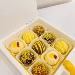 A clean, elegant shot of my assorted truffle box in a simple white gift box. These handcrafted chocolates are a perfect and luxurious gift for Raksha Bandhan.
