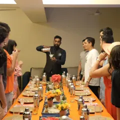 Our lead mixologist demonstrates the correct pouring technique to an engaged group of guests. Our workshops are designed to be both educational and highly interactive.