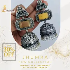 This is one of my classic oxidized jhumkas, shown here with a warm yellow stone. The design features a rectangular top piece and a detailed dome with tiny pearl accents, offering a timeless ethnic look.