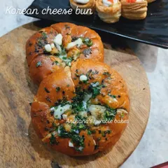 My Korean Cream Cheese Buns are a must-try. These soft buns are filled with sweetened cream cheese and soaked in a savory garlic butter sauce, then baked until golden.