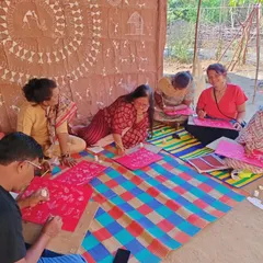 A candid moment of learning and laughter during our Warli art retreat. We believe in creating a relaxed and joyful atmosphere for our students to explore their creativity.