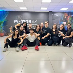 This is my tribe! A happy moment with my amazing ladies' batch after nailing a routine. My studio is all about this supportive, fun community where everyone feels welcome.