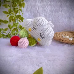 A close-up of the plush cloud and its colorful hanging drops.