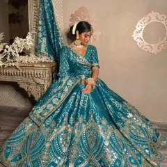 This is one of my most popular rental lehengas for sangeet functions. The rich teal color and gota patti work are perfectly complemented by the simple choker and earrings.