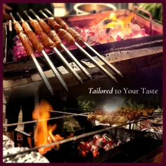 Our live grill station in action, with seekh kebabs cooking over hot coals. We tailor our menus to your taste, transforming every bite to perfection for both elegant affairs and casual gatherings.