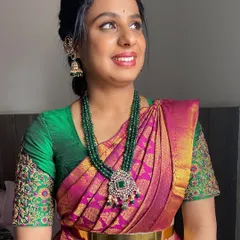 A soft and pretty look for a guest. The makeup is natural and glowing, paired with a traditional hairstyle that is perfect for a wedding ceremony.