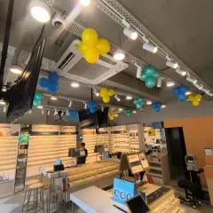 Another view of the interior ceiling decorations at the Lenskart opening, adding pops of color throughout the retail space.