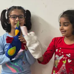 Look at the joy and interaction between these two friends and their new puppets. Creating the puppets is only half the fun; bringing them to life is where their personalities shine.