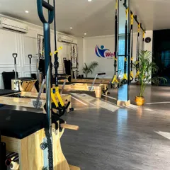 Our studio layout is designed for both group energy and individual focus, featuring a full set of reformers and TRX suspension trainers.
